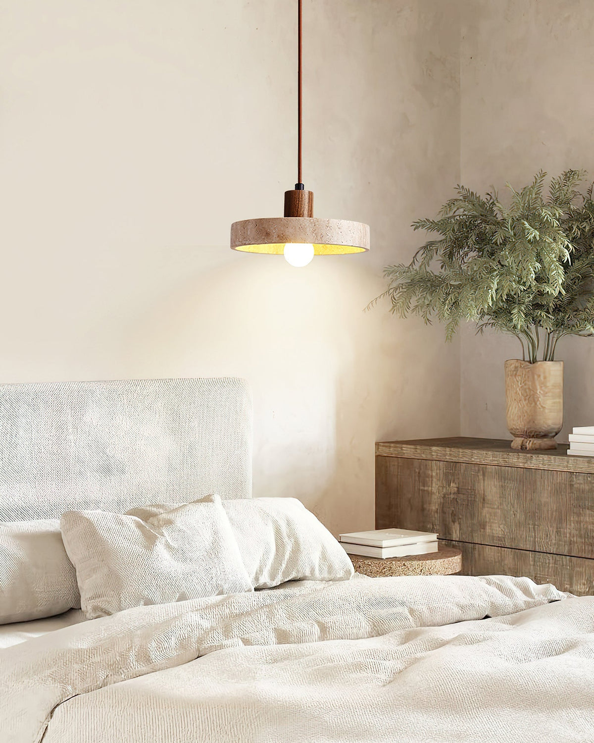 The Kairi Pendant Lamp emitting a soft, warm glow.