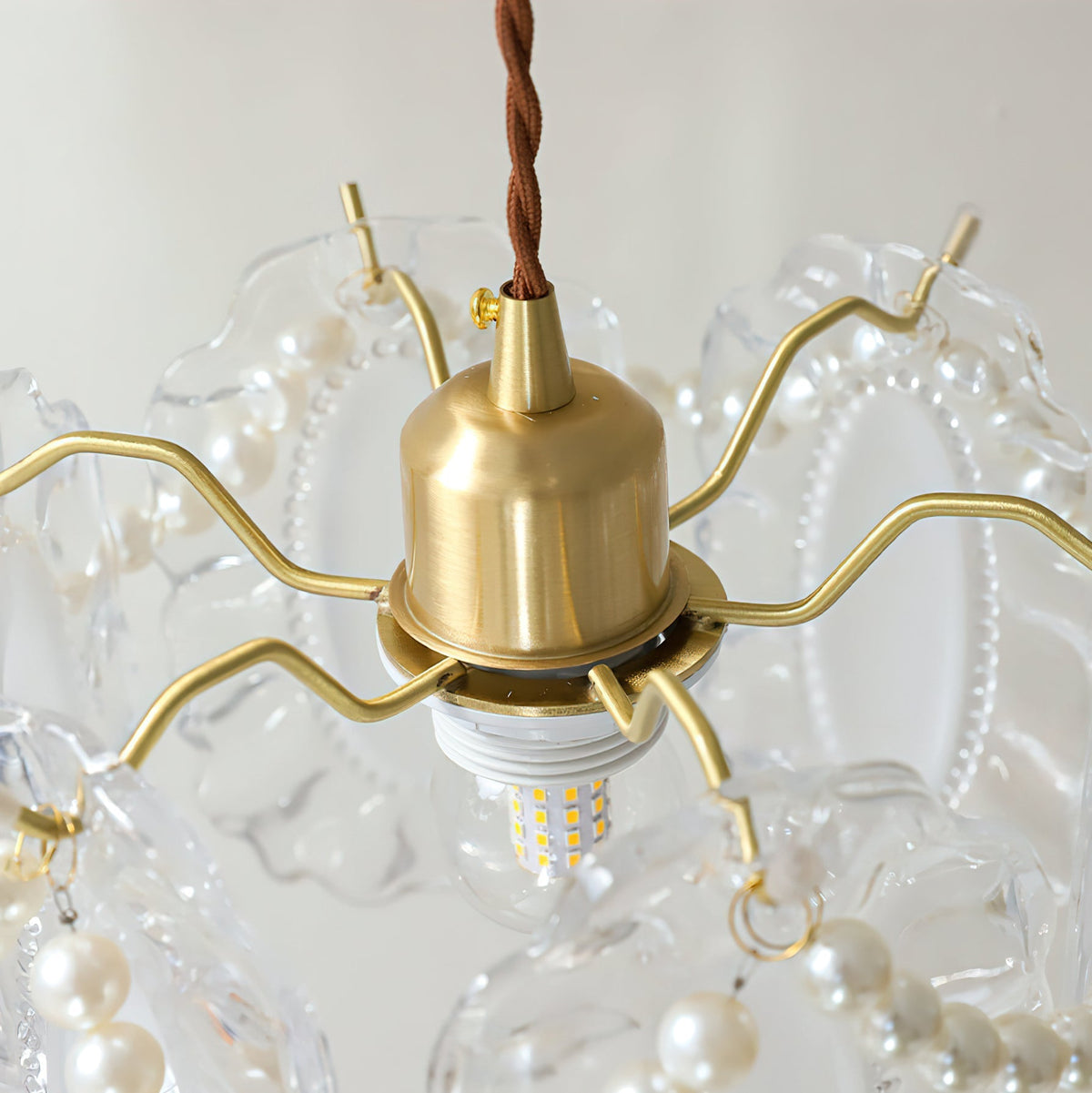 The Kano Glass Wall Light mounted on a neutral colored wall.