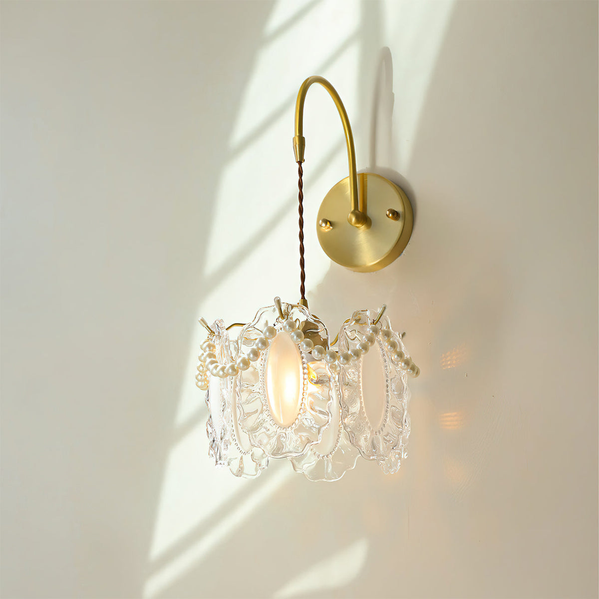 The Kano Wall Light with a clear glass shade option.