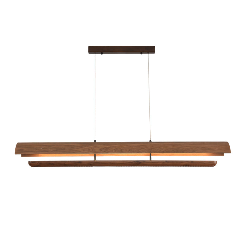 Kanoe Linear Chandelier against a dark wall, showcasing its warm light.