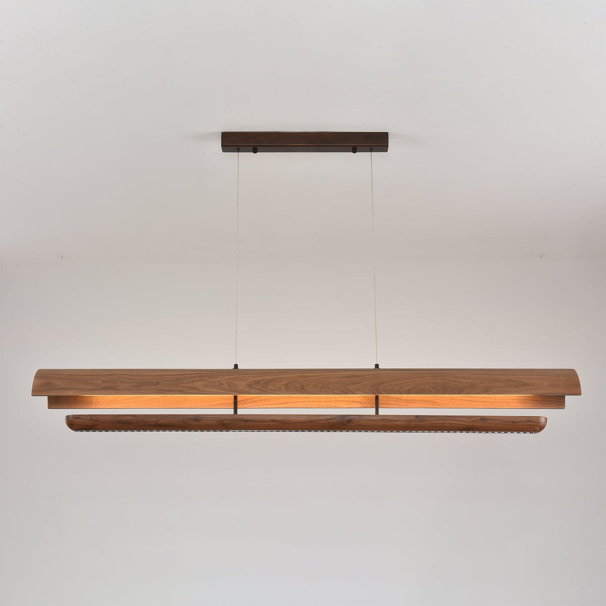 Detail shot of the walnut wood grain on the Kanoe chandelier.