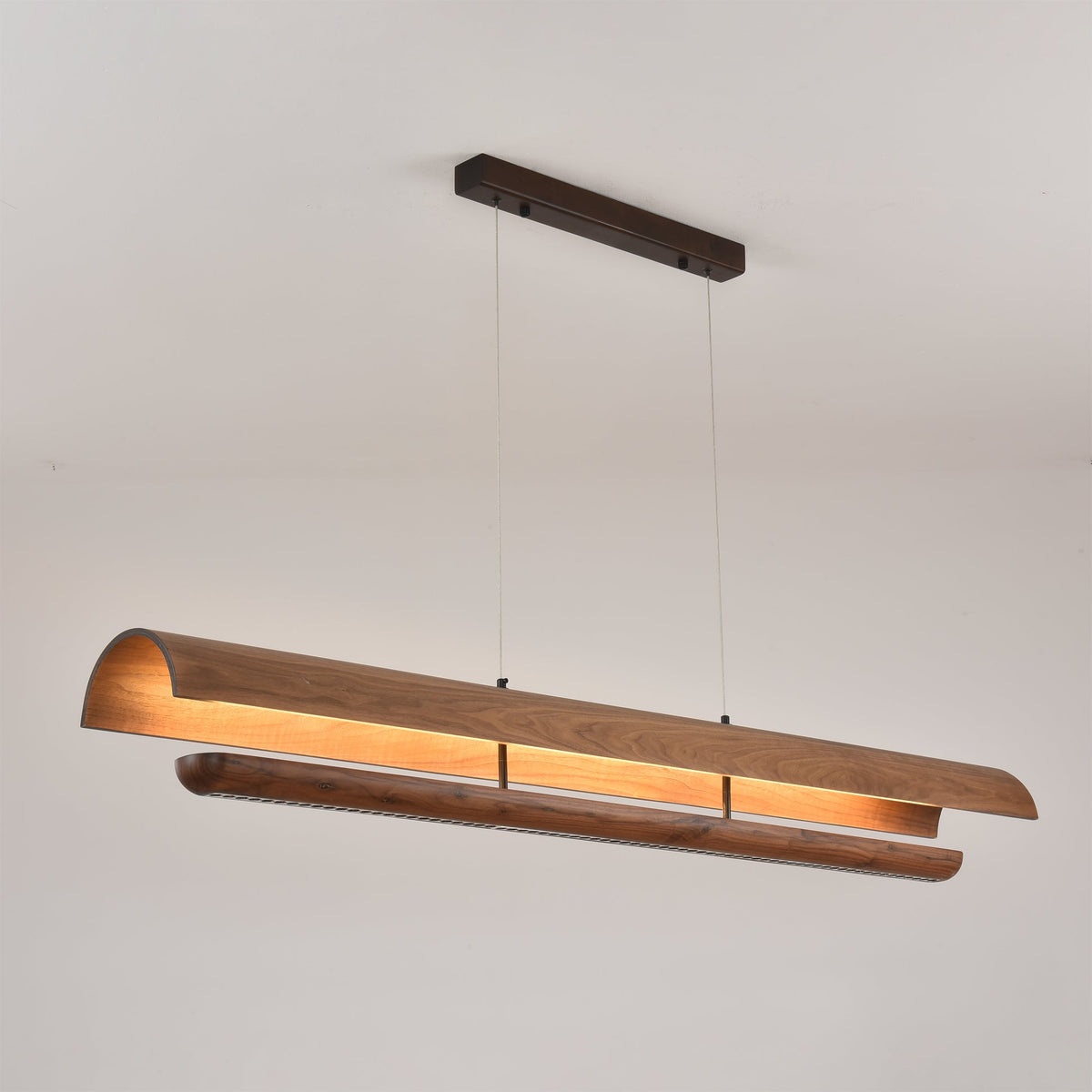 The Kanoe Linear Chandelier shown in its medium size option.