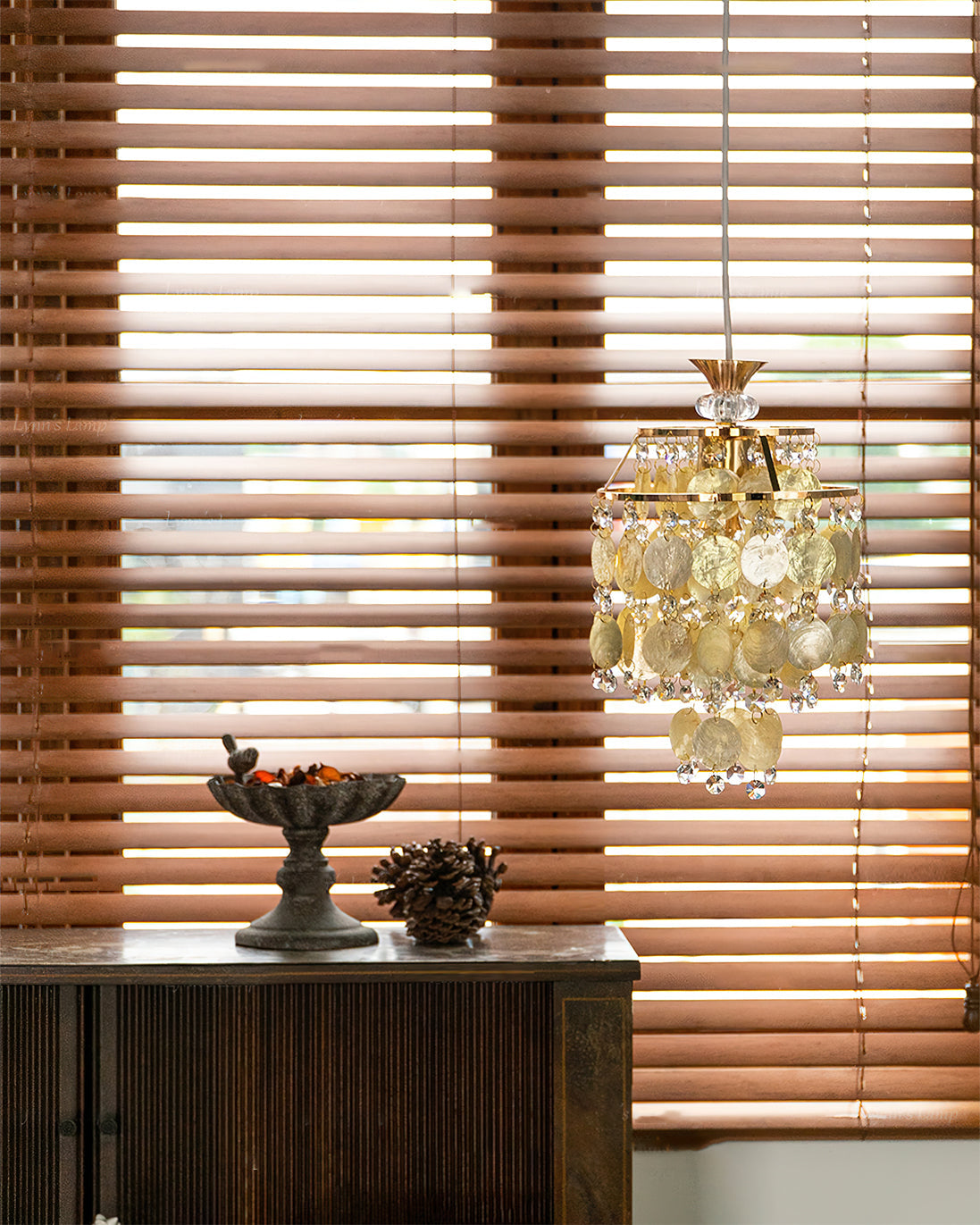 Illuminated Katinka Pendant Light casting a warm, golden glow.