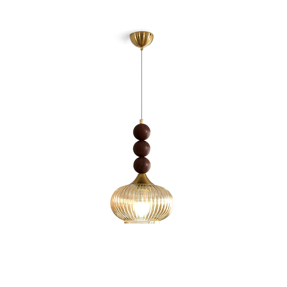 Kaydan Pendant Lamp with an amber ribbed glass shade and gold accents.
