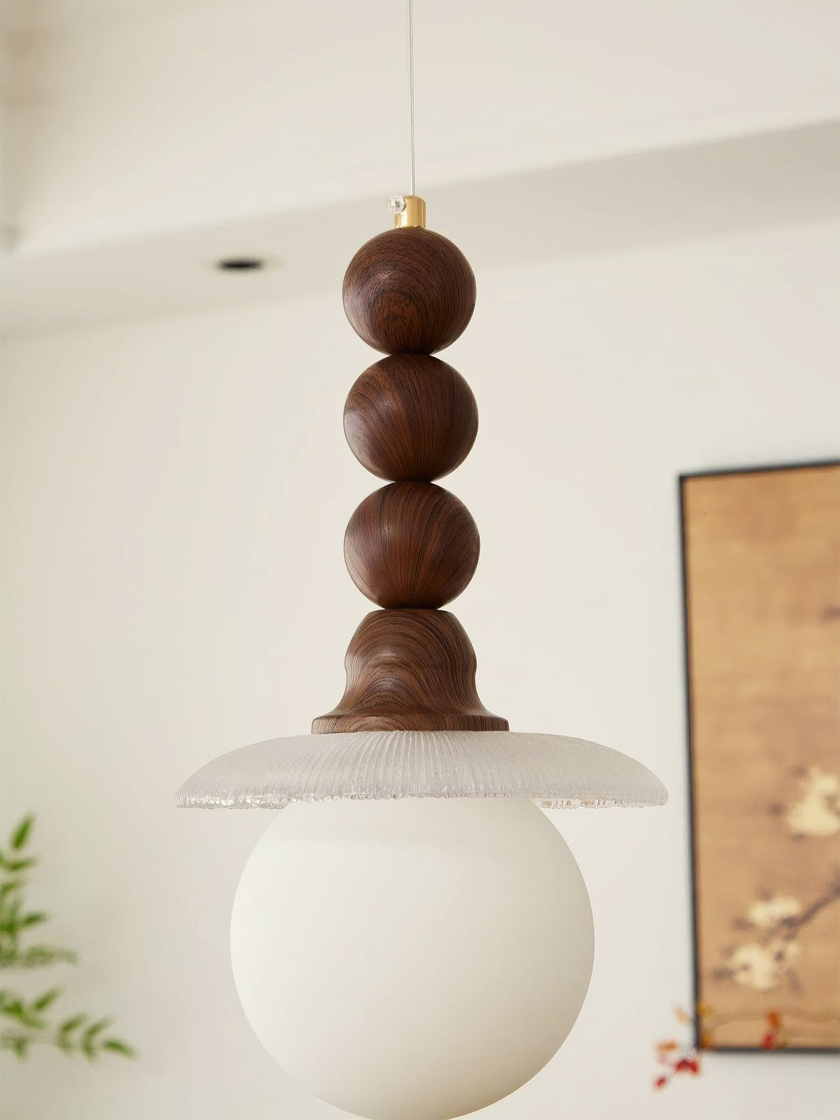 The ceiling mount and suspension wire of the Kaydan Pendant Lamp.