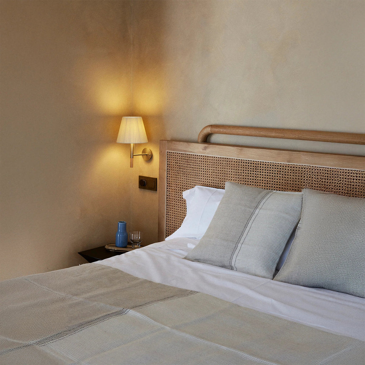 Close-up of the Kilkee Wall Lamp's fabric shade and metal arm.