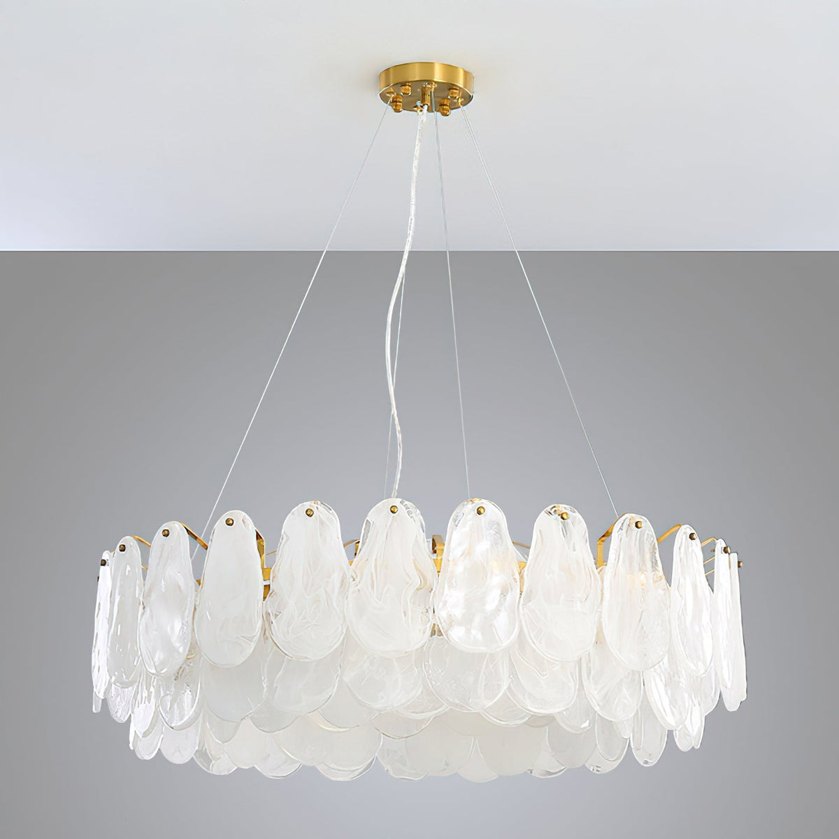The Leon Chandelier installed over a minimalist kitchen island.