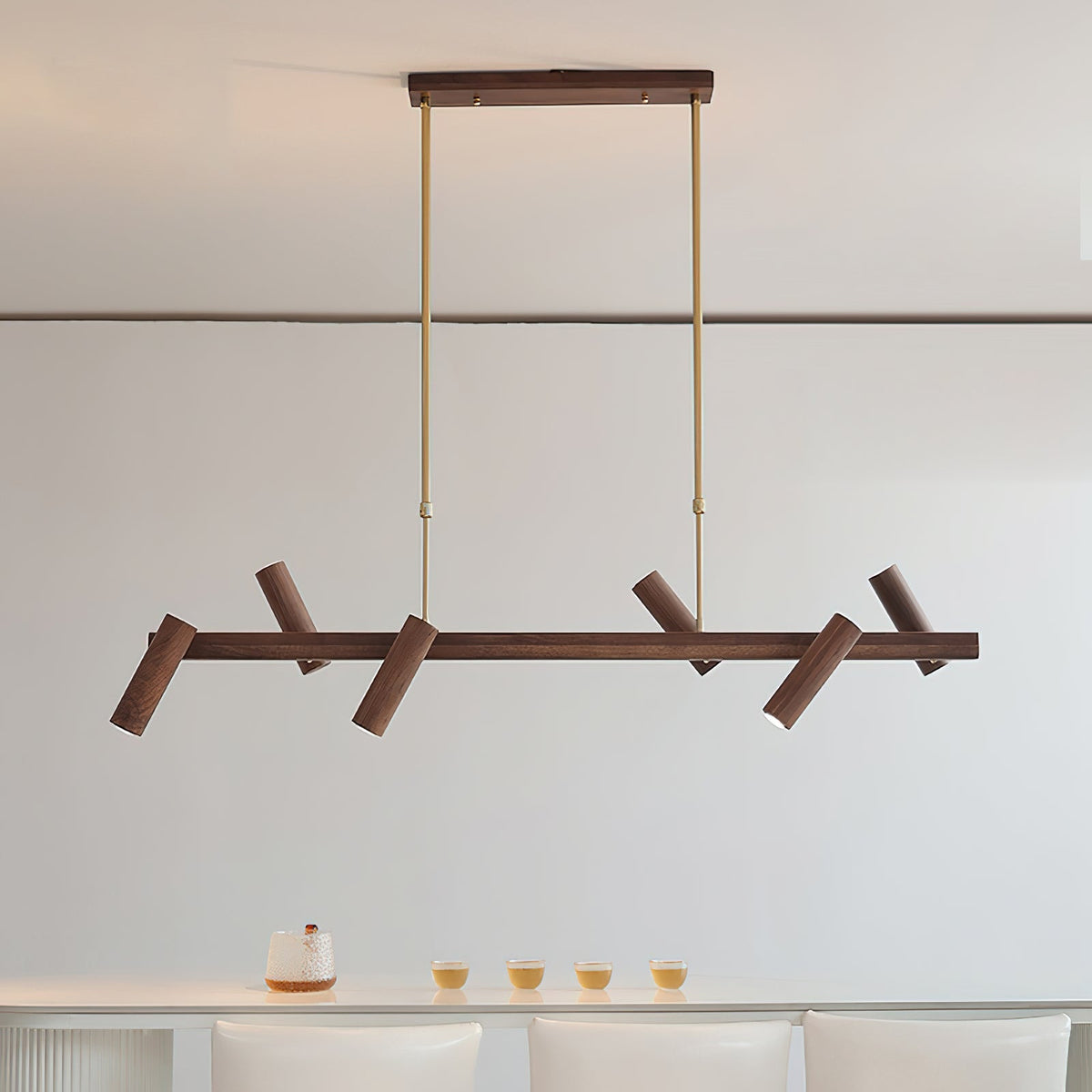 Konnect Wood Chandelier hanging over a contemporary dining table.