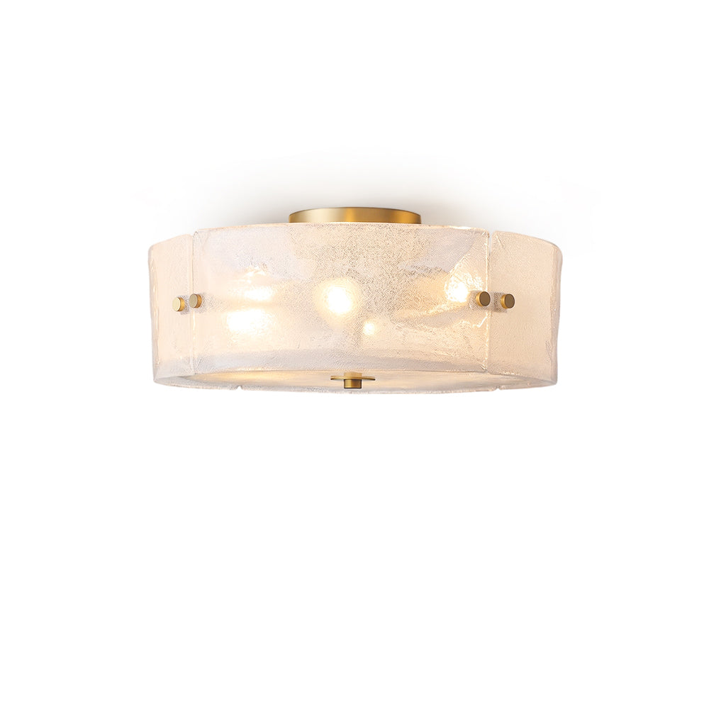 Kora Textured Glass Flush Mount with brass base, viewed from the front.