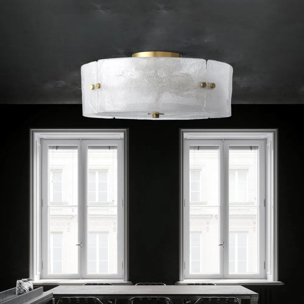 The Kora flush mount light illuminated, casting a warm and inviting glow.
