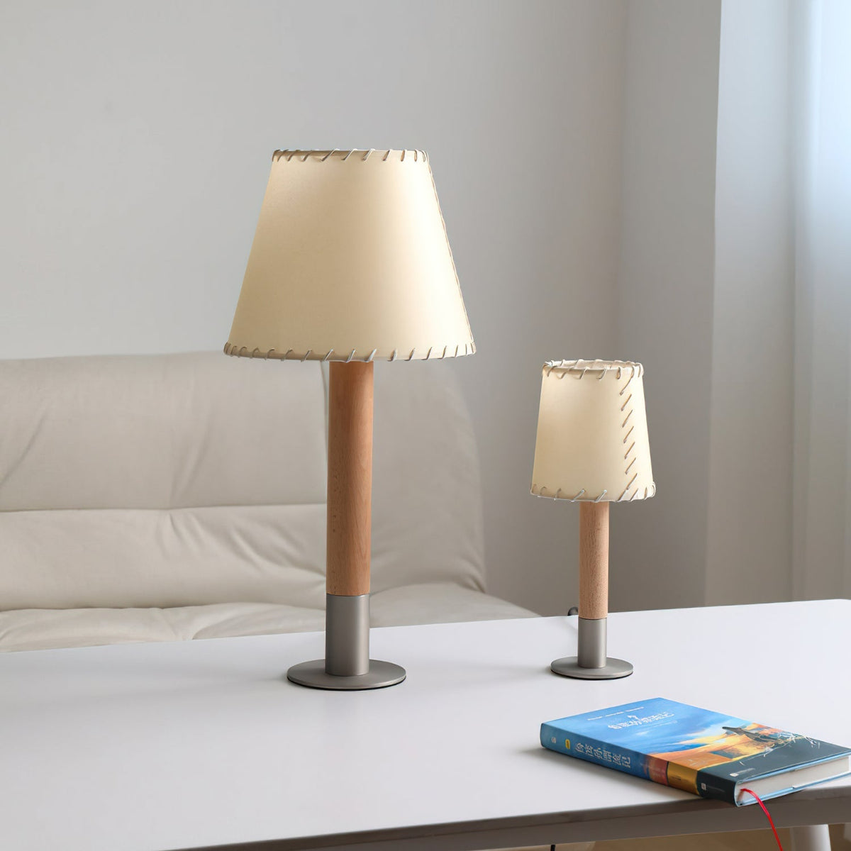 Close-up of the Kove Table Lamp's parchment shade emitting a warm glow.