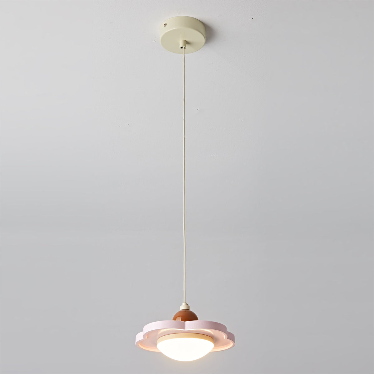 Side profile of the Laguna Pendant Light in pink.