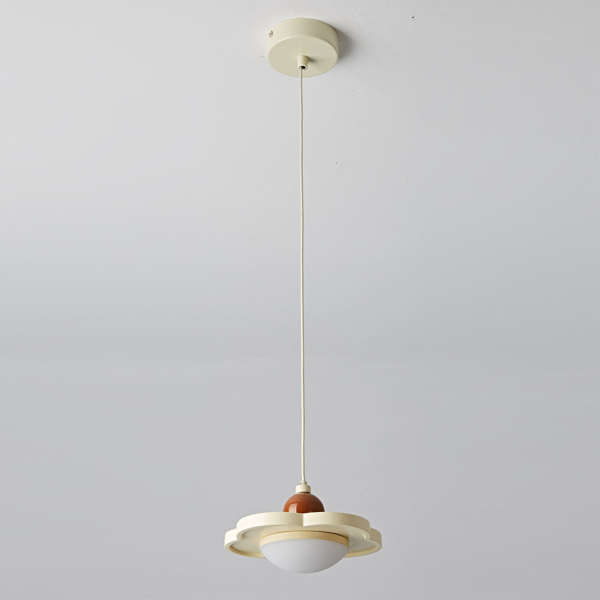The cream Laguna Pendant Light styled in a minimalist space.