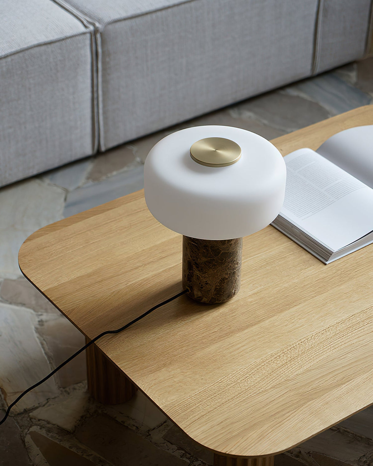 Side profile of the Lennox Marble Table Lamp, showcasing its sculptural form.