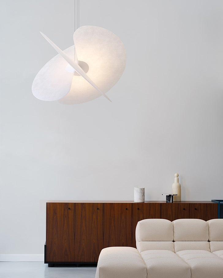 A large Levante Pendant Light illuminating a contemporary dining area.