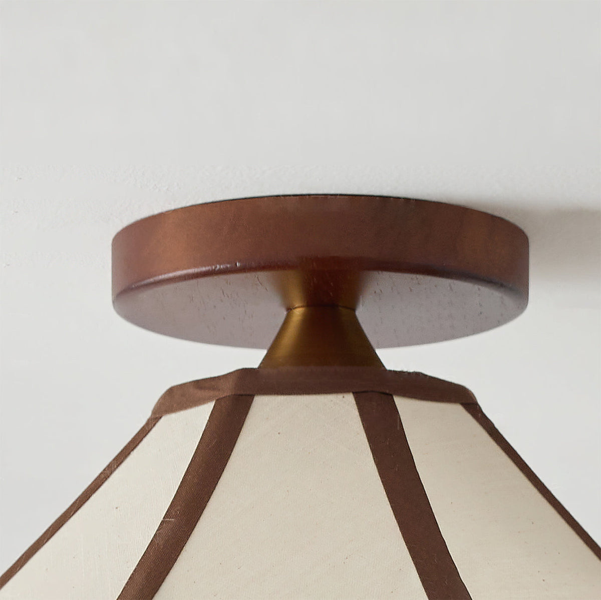 Lifestyle image showing the Lonzo Ceiling Light in a dining area.