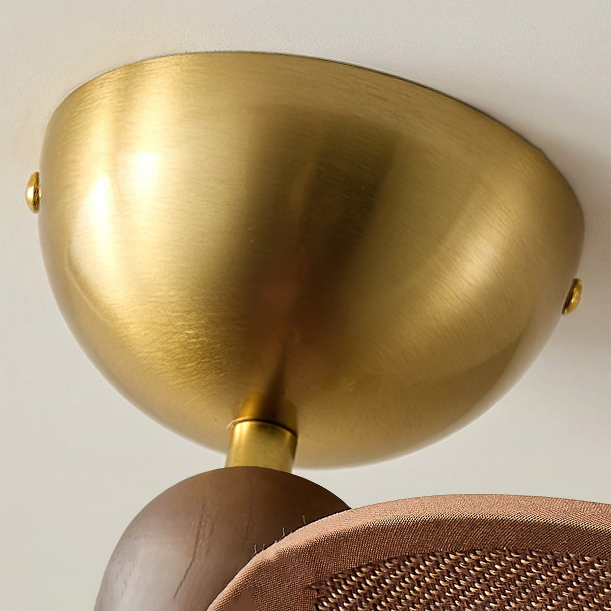 The Lucca Chandelier hanging over a dining table, providing warm ambient light.