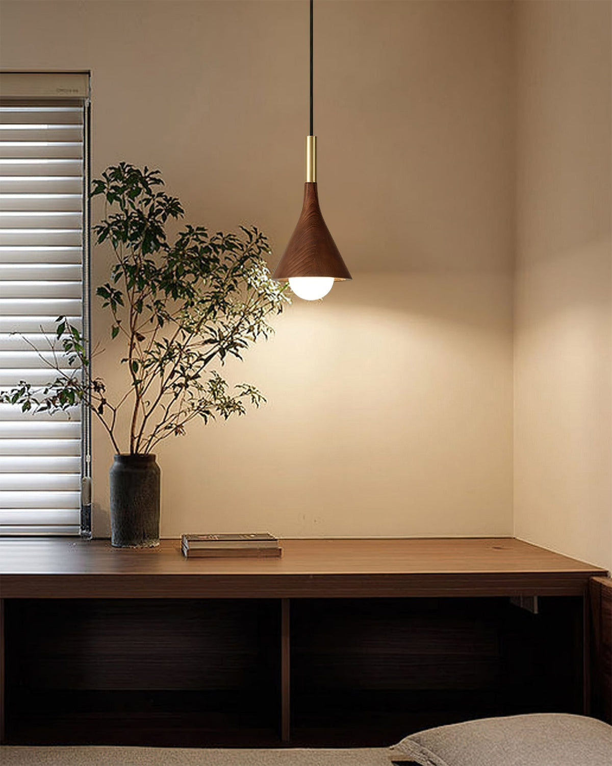 Lucian Pendant Lamp hanging over a modern dining table.