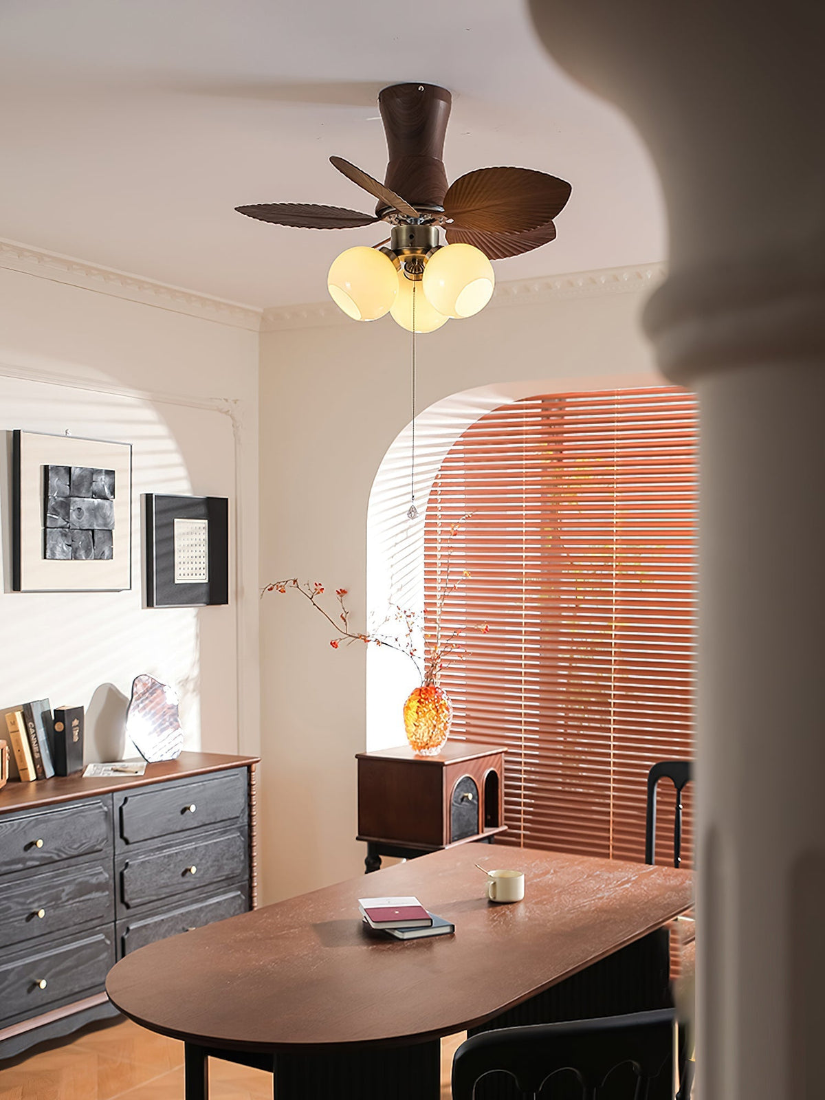 The light of the Malibu Ceiling Fan turned on, casting a warm glow.