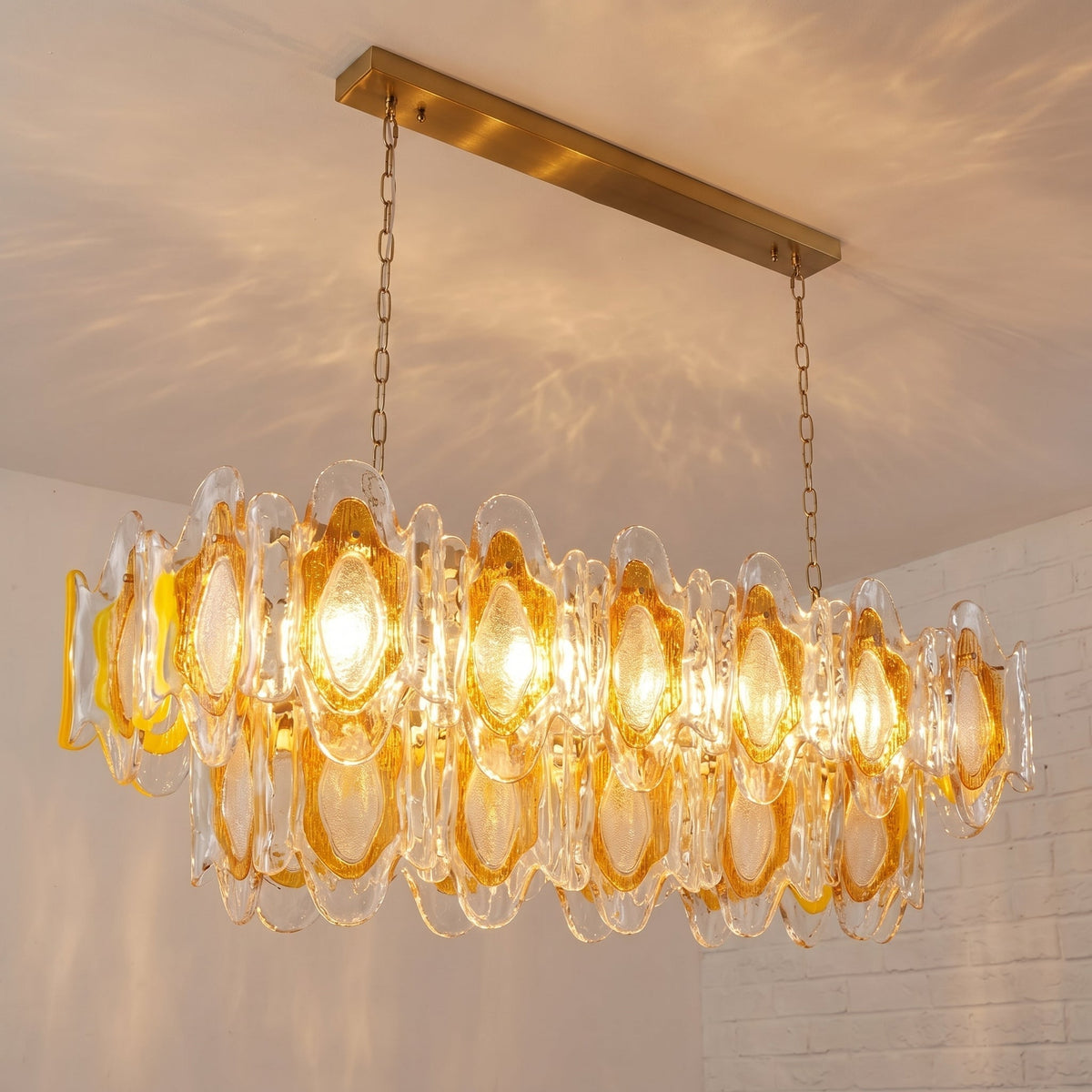Marrina Chandelier hanging above a modern dining table.