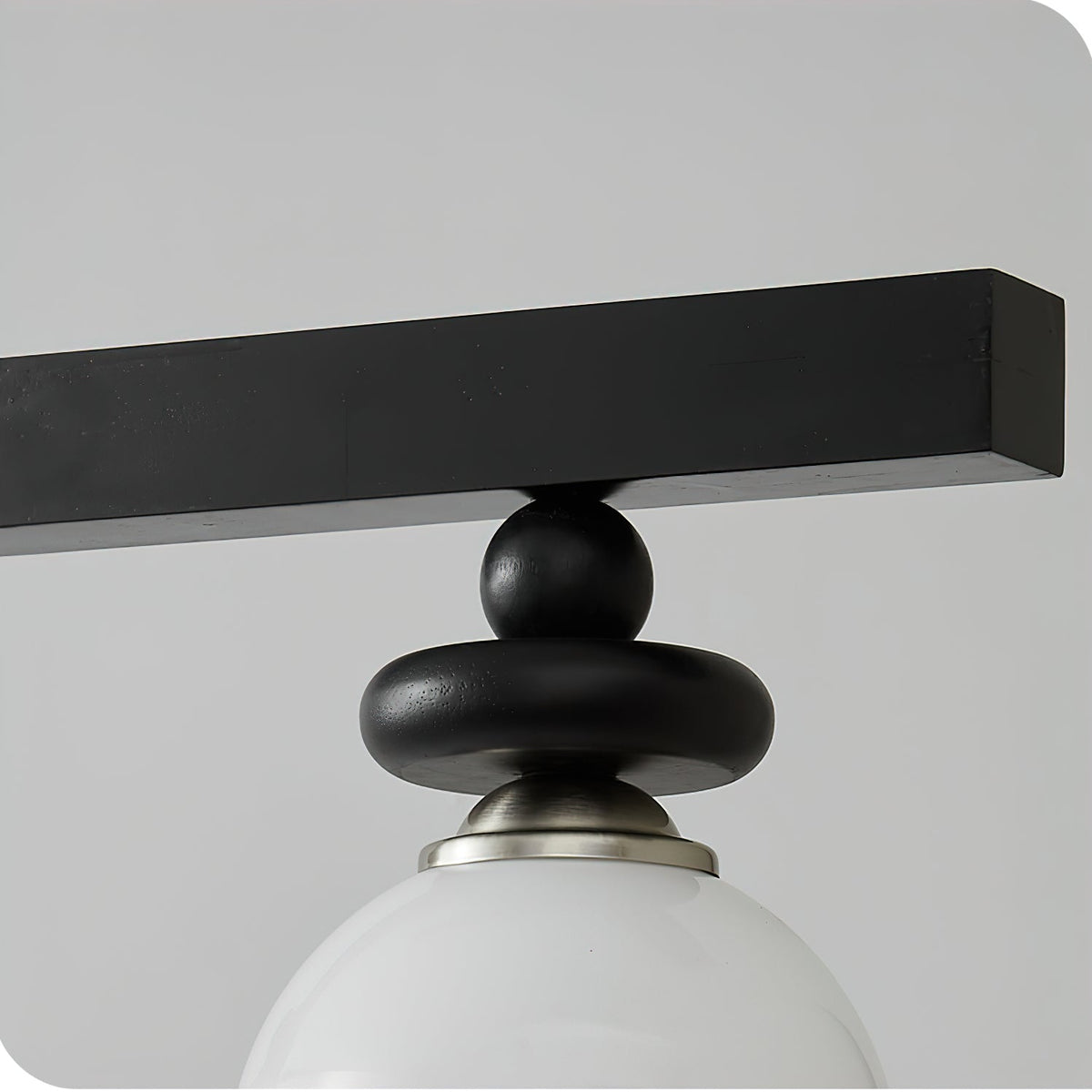 The Maru Pendant Light casting a warm, inviting glow in a darkened room.