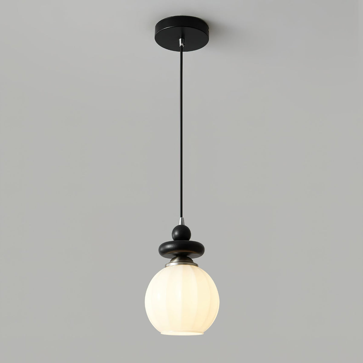 The 4-light Maru Pendant fixture, perfect for commercial or residential spaces.