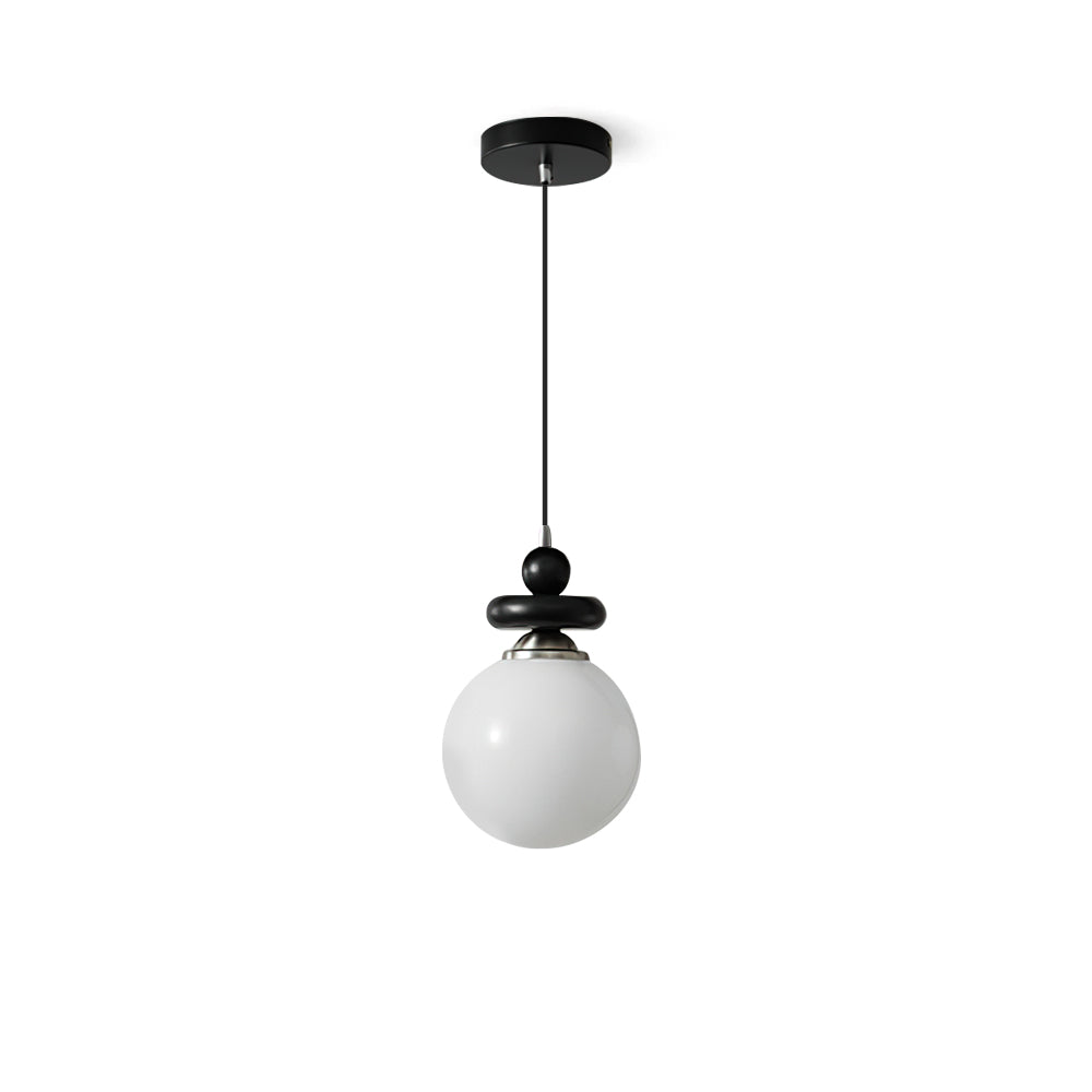 Maru Pendant Light with a ribbed glass globe and black metal frame.