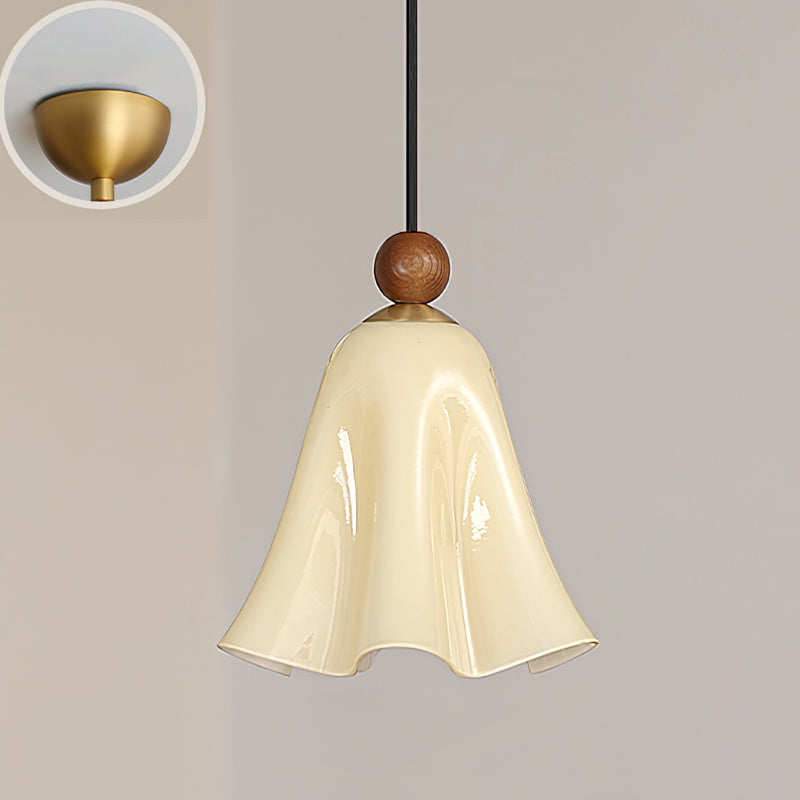 Lifestyle image of the pendant light in a cozy reading corner.