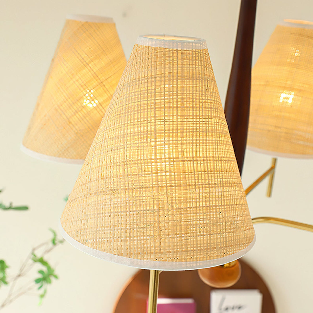 The texture of the beige fabric shade when the light is on.