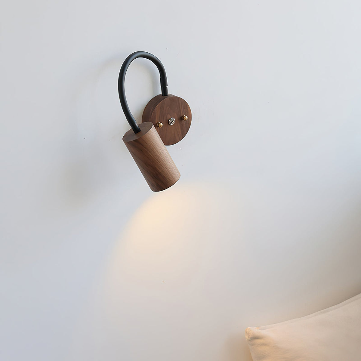 Close-up of the wooden backplate and cylindrical lamp head.