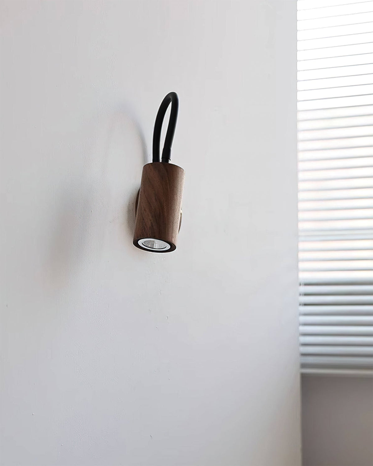 Lifestyle image of the Micro Wall Lamp illuminating a hallway.