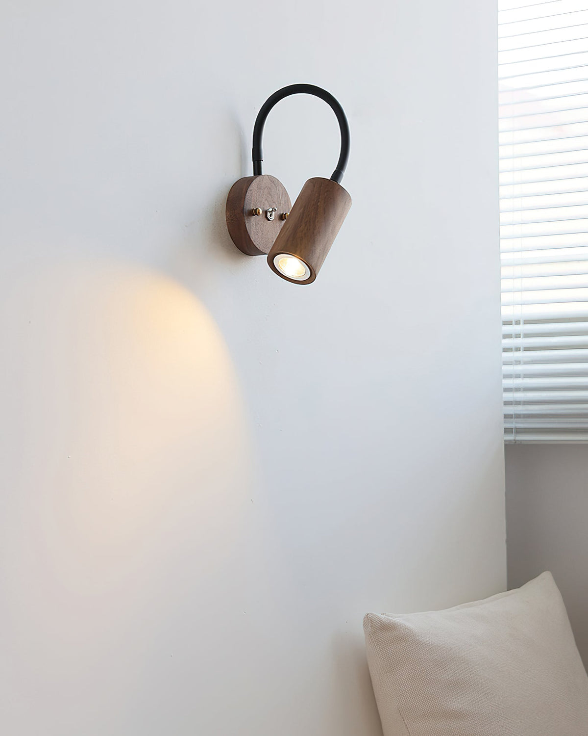 The Micro Wall Lamp shown from a low angle to highlight its form.