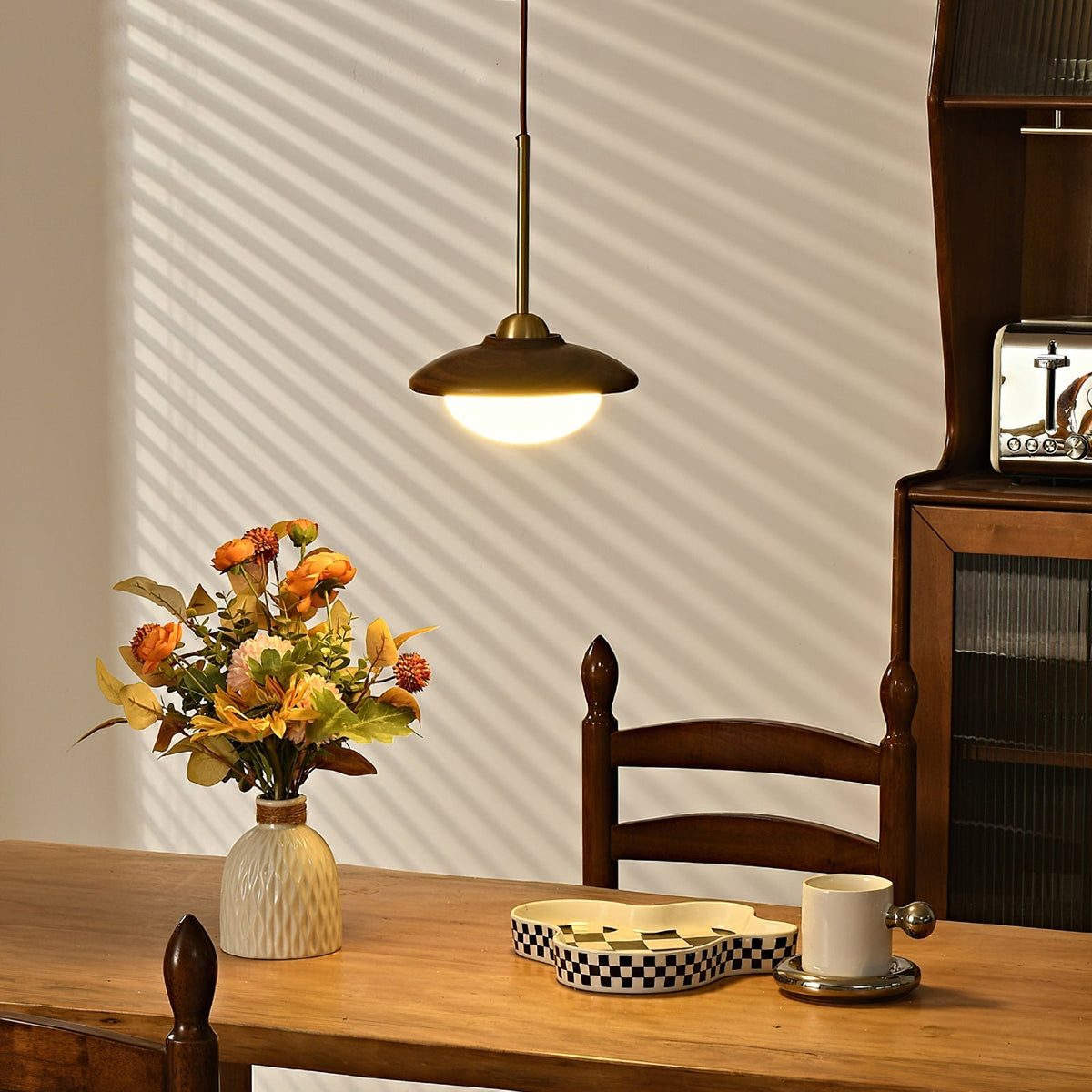 Three-light version of the Milivia Pendant Light with a long walnut wood canopy.