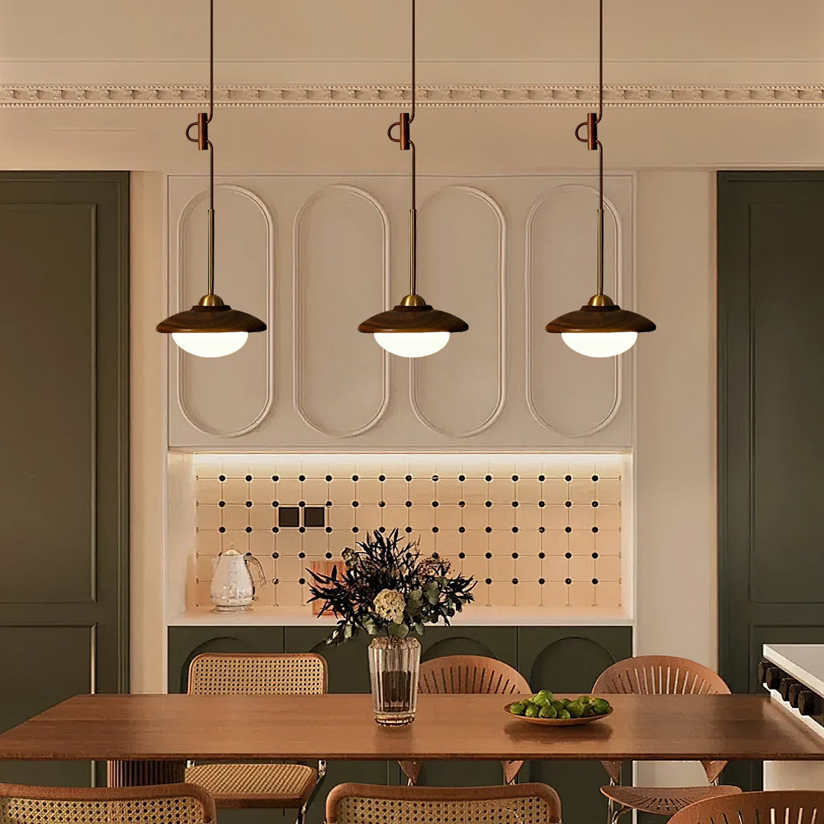 Milivia Pendant Light hanging over a modern dining table.
