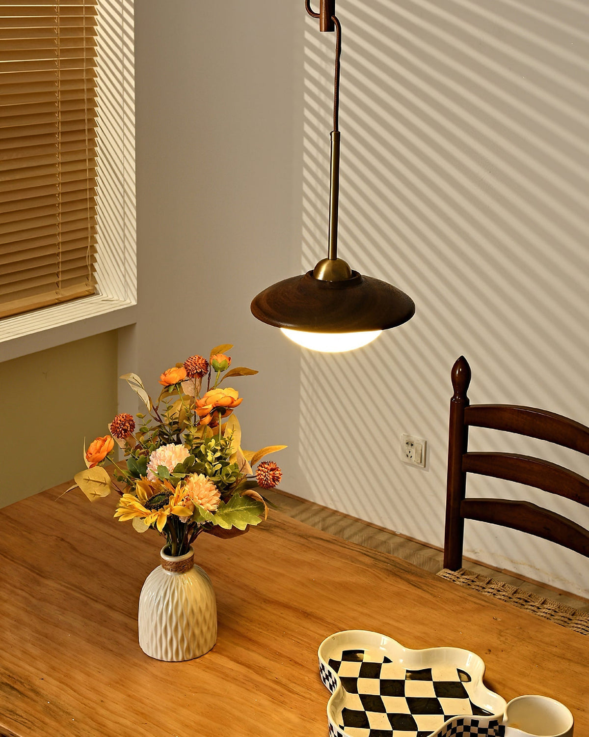 Angled shot of the single-globe Milivia Pendant Light.