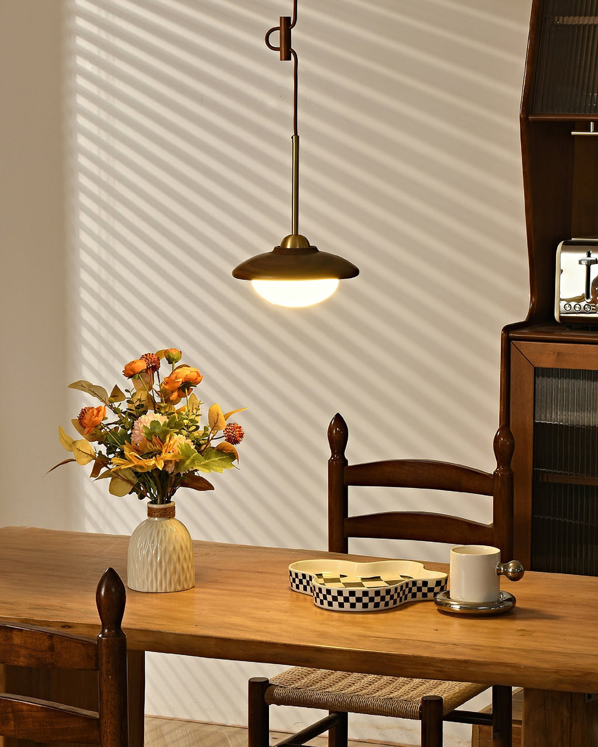 Full view of the three-globe linear Milivia Pendant Light.