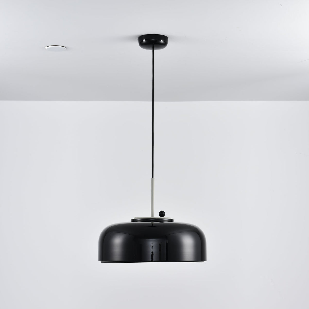 Misha Pendant Light in red, as a pop of color in a neutral room.