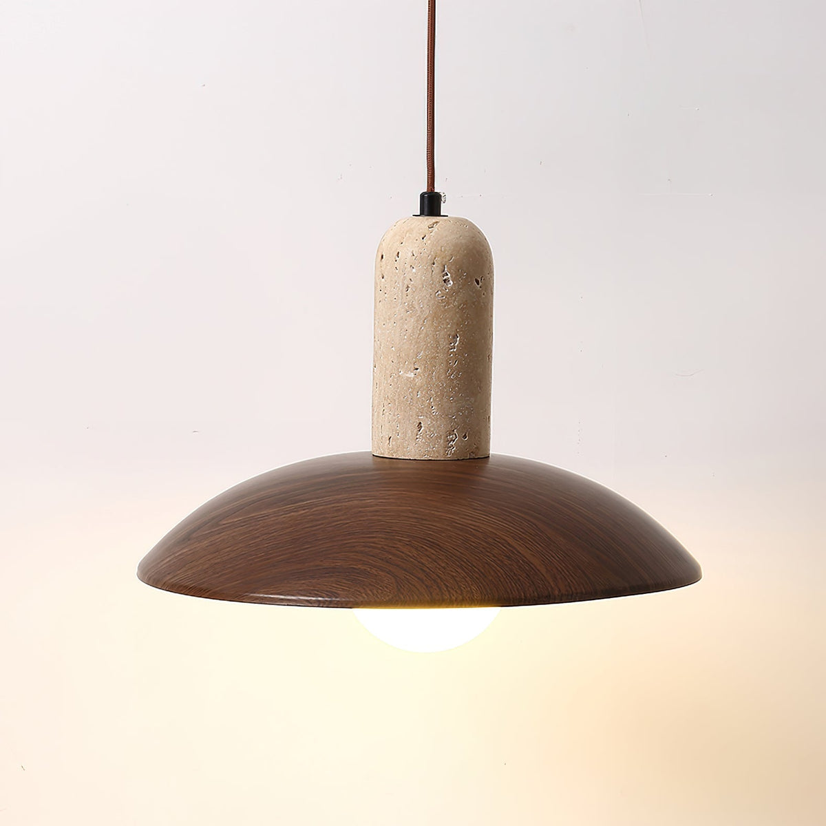 The 3-light linear Molly Pendant Lamp over a long kitchen island.