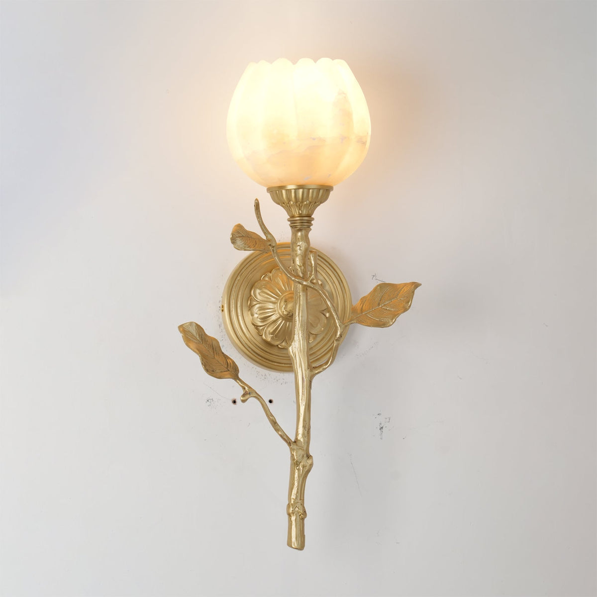 Close-up of the hand-carved alabaster shade showing its natural stone veining.