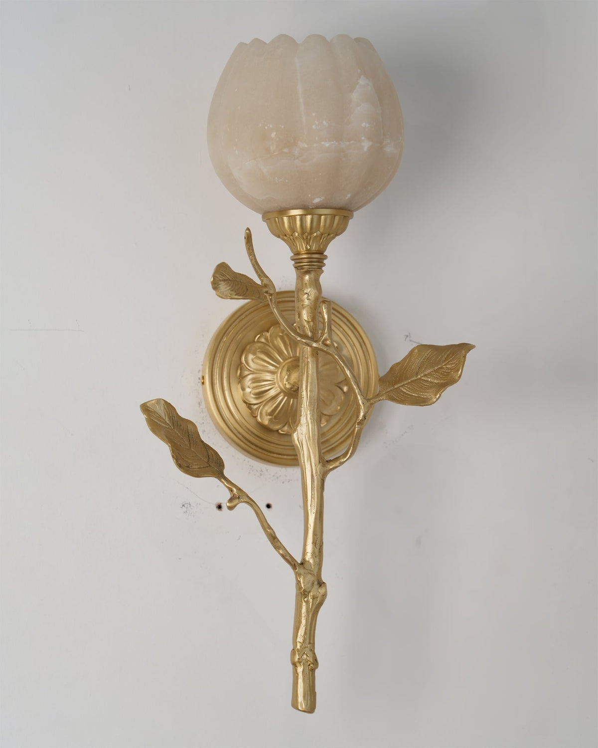 A pair of Natalia Wall Sconces flanking a bathroom mirror.