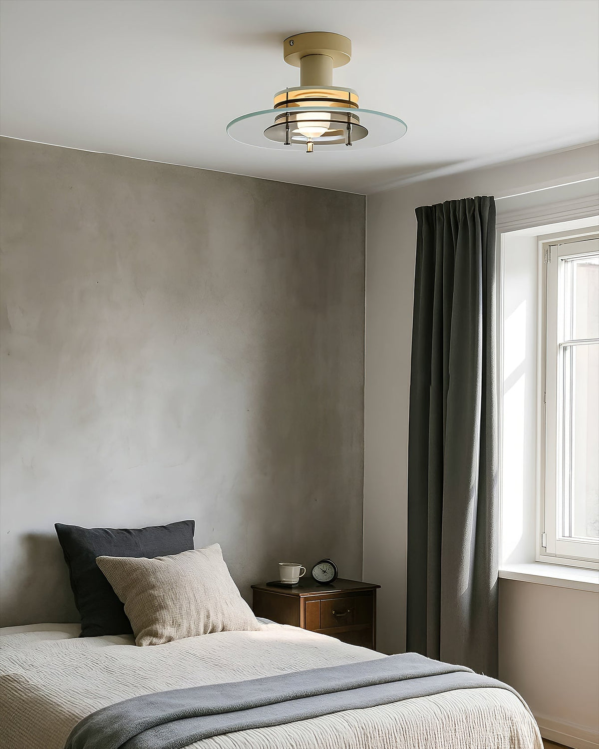 Detail shot showcasing the white metal housing and clear glass shade.