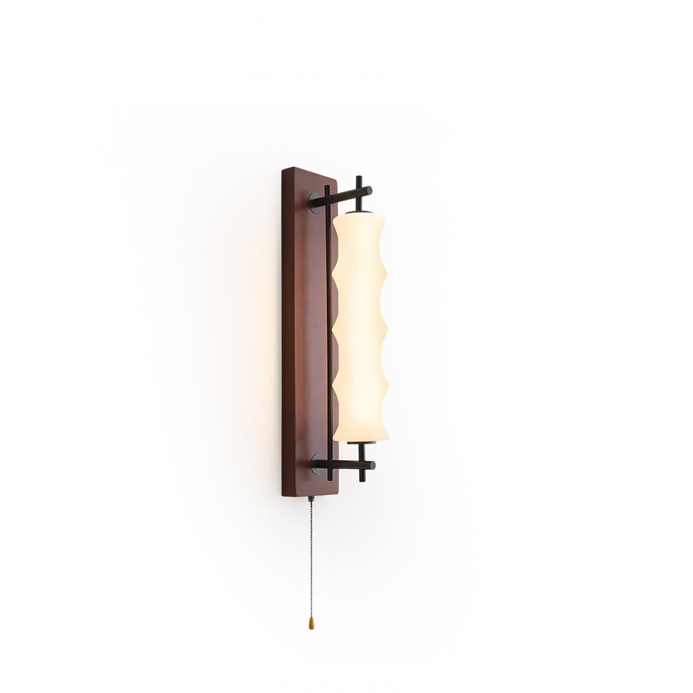 Nesta Wavy Glass Wall Sconce with wood finish against a light wall.