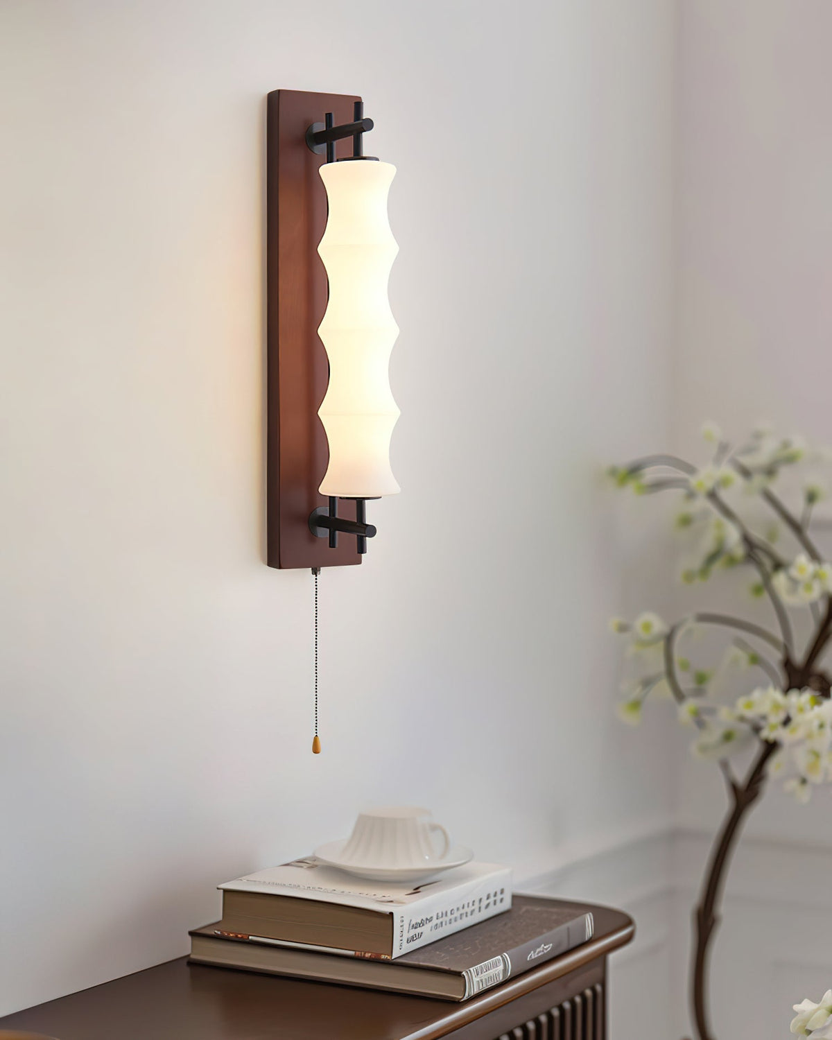 Side profile of the Nesta wall sconce showing the gooseneck arm.