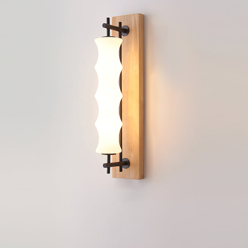 Close-up of the wavy borosilicate glass shade on the Nesta wall sconce.
