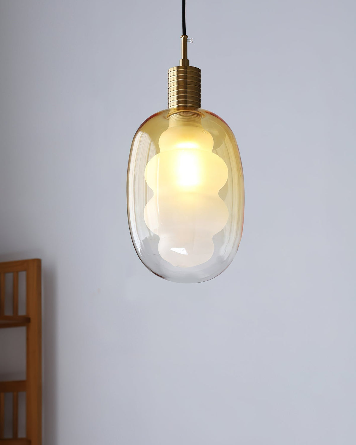 Niche Pendant Light casting ambient light in a living space.