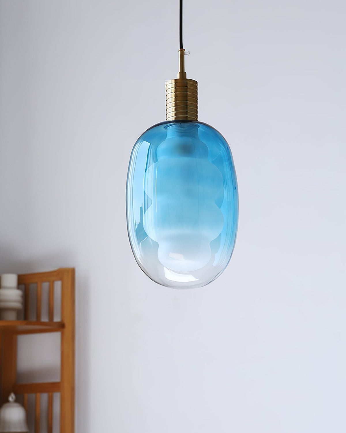 Angled view of the Niche Pendant Light showing its modern design.