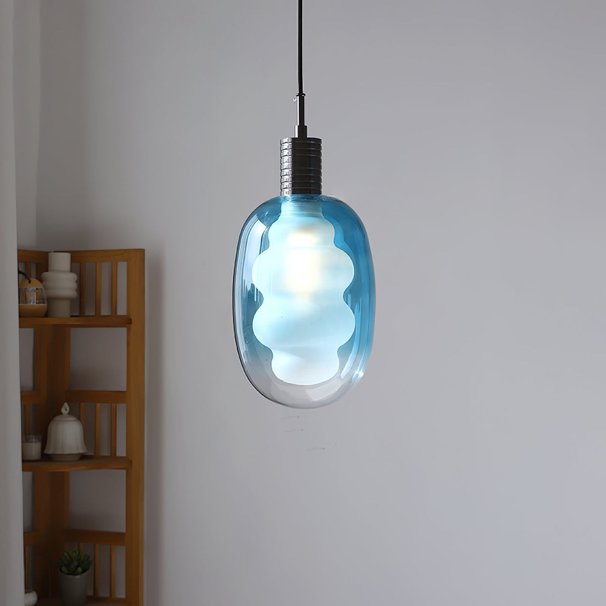 Close-up of the sculptural glass shade of the Niche Pendant Light.