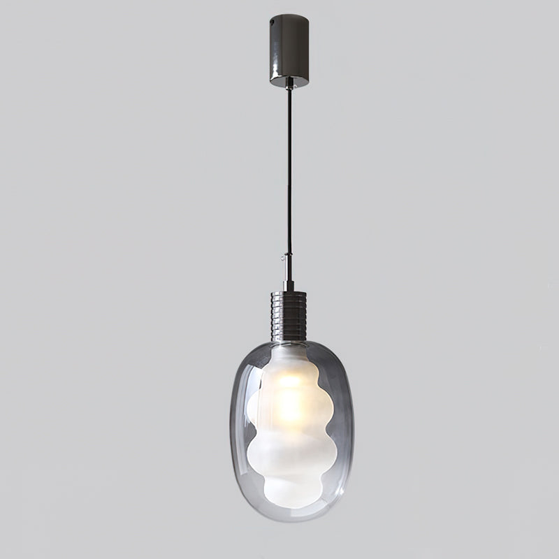 A pair of Niche Pendant Lights hanging together over a table.