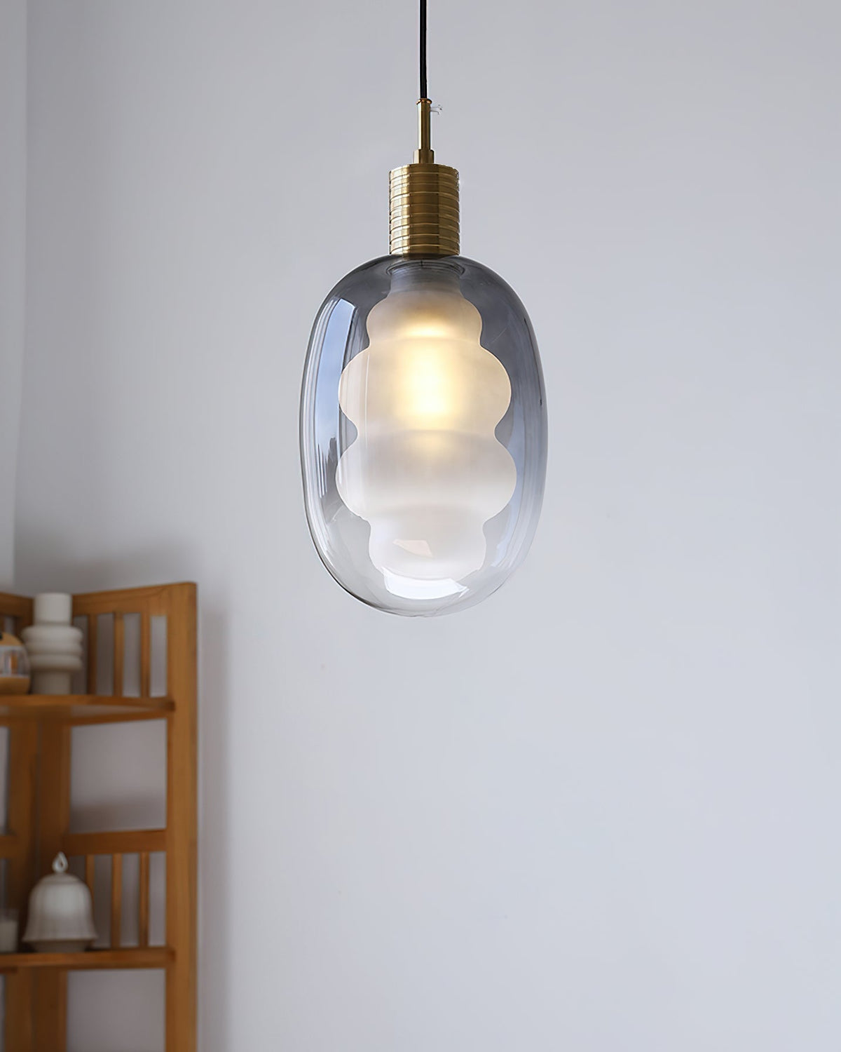 The Niche Pendant Light hanging over a kitchen island.