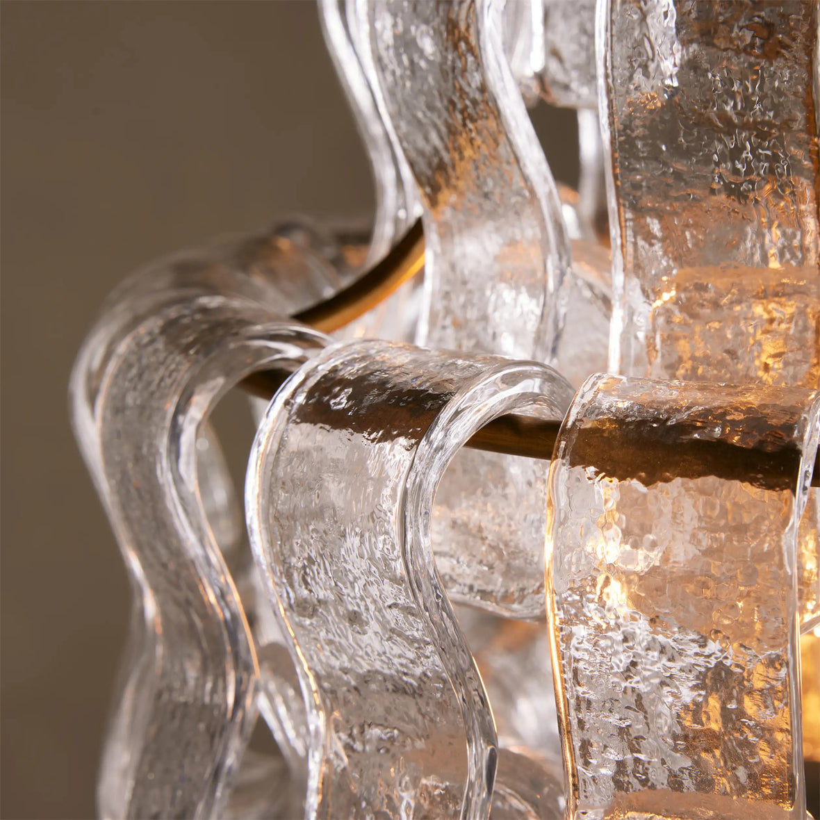 The Nirsa Pendant Light turned off, showing the clear and gold glass detail in natural light.